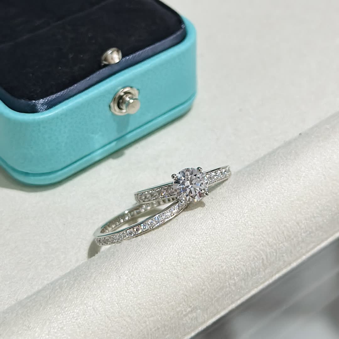 Tiffany & Co. Solitaire Ring with Diamond Band